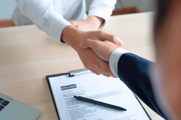 Photo of two people shaking hands