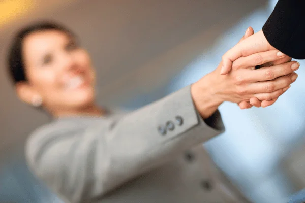 Photo of two people shaking hands